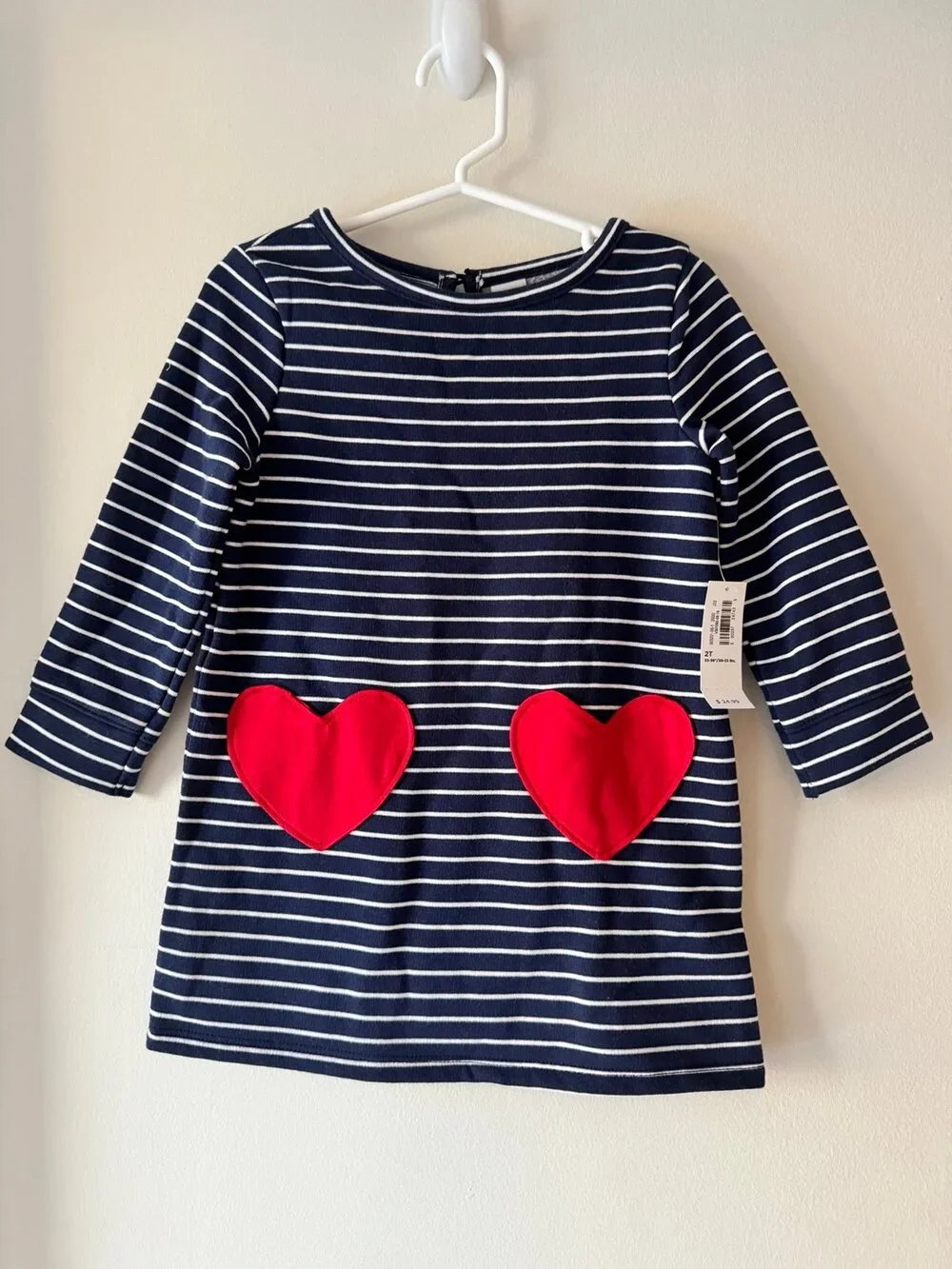 Old Navy girls’ striped sweater dress with heart pockets